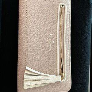 kate spade pale pink pebbled leather zip tassel wallet
